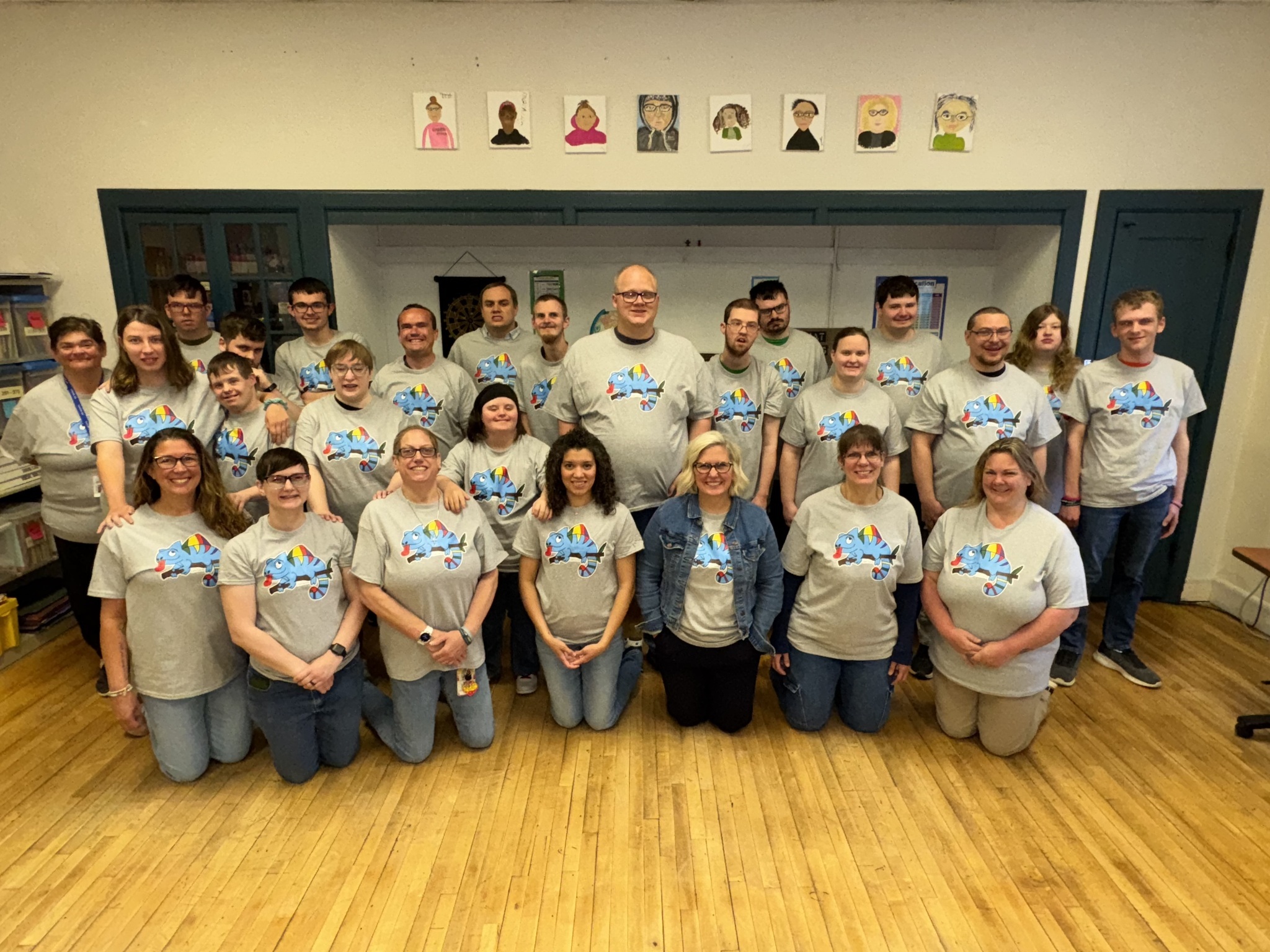 Adult Transition Center students and teachers wearing shirts with the colorful chameleon design