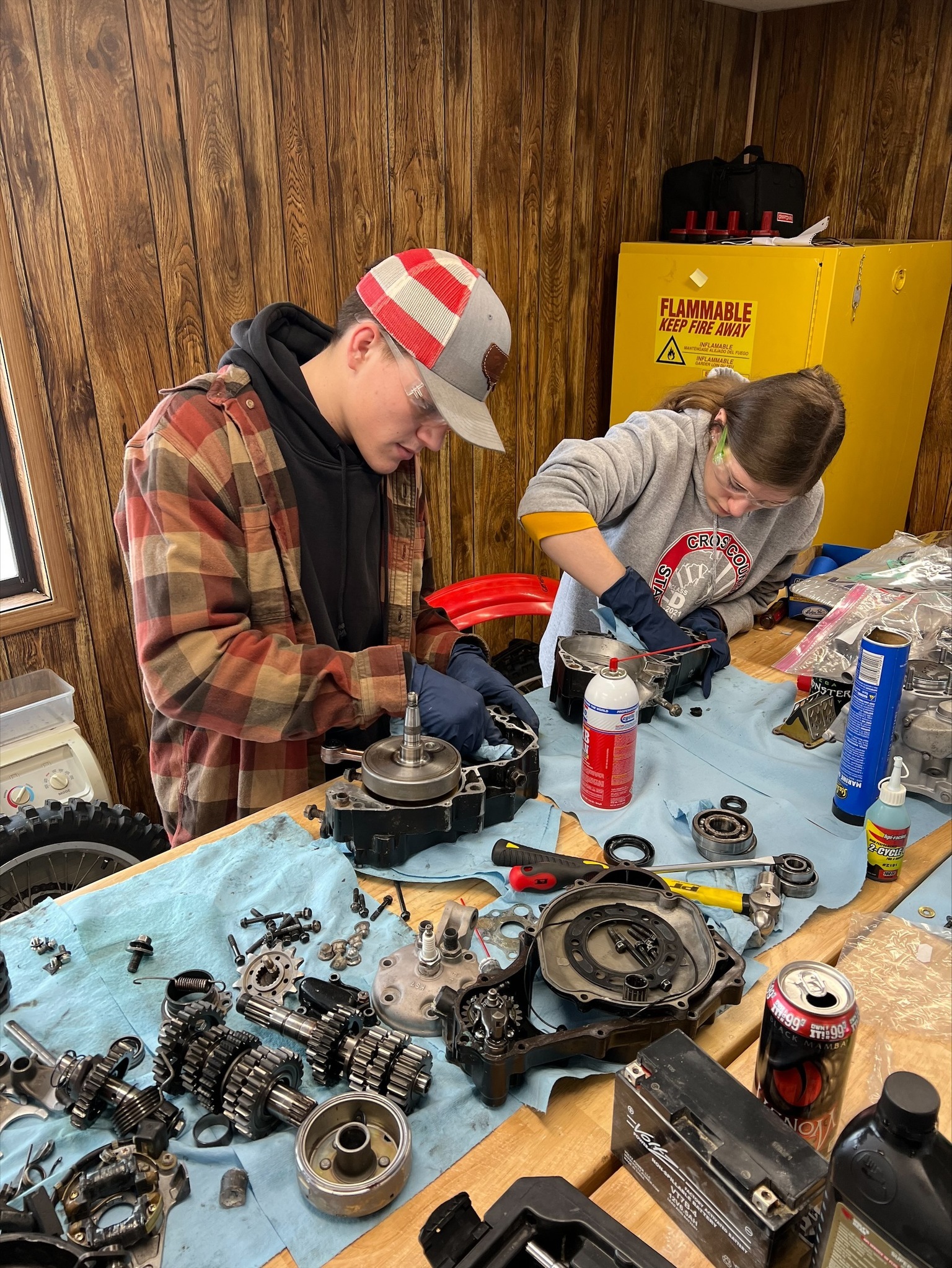 rec engine students working on a motor