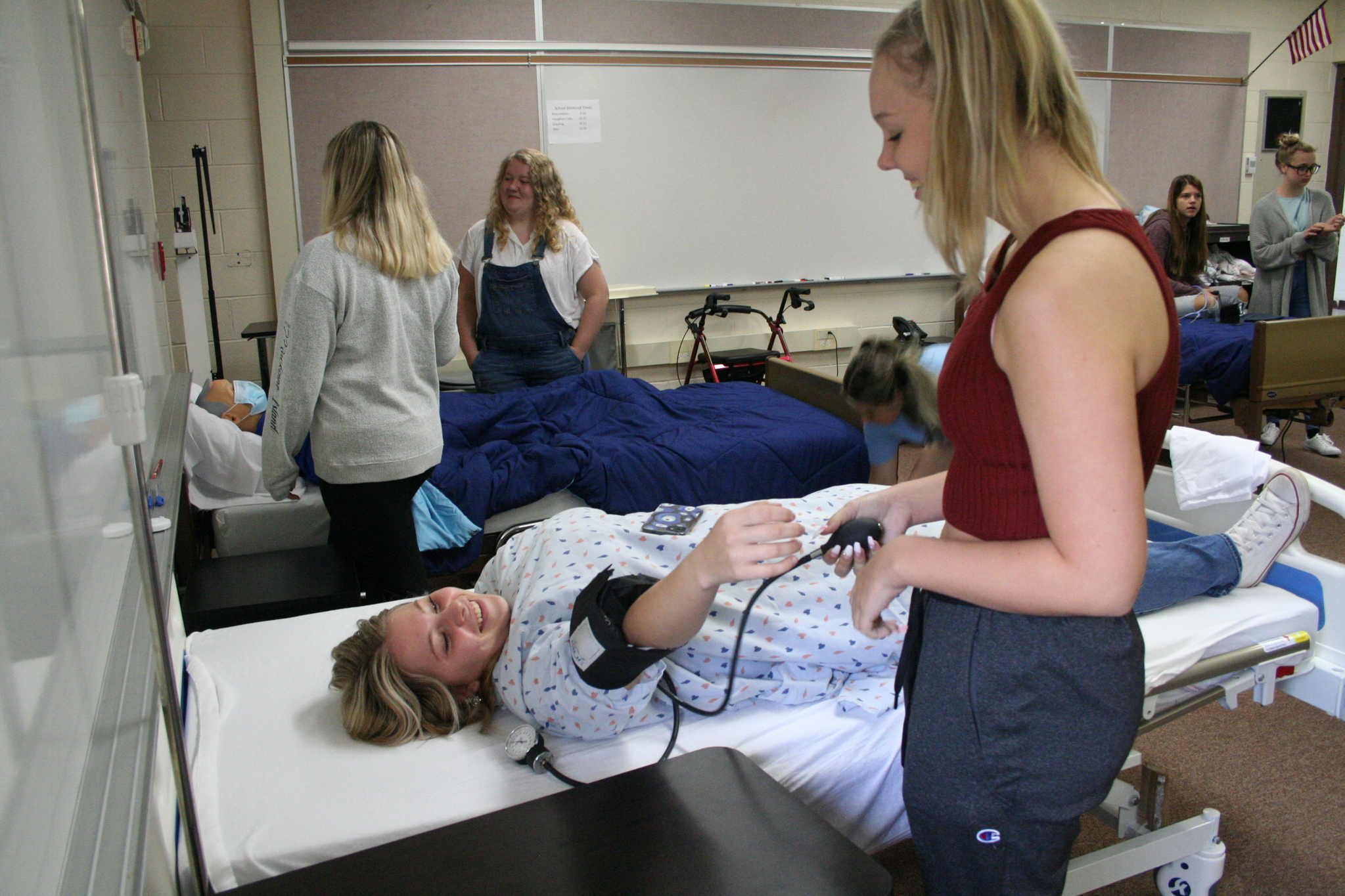 Medical Occupations student practicing taking a blood pressure