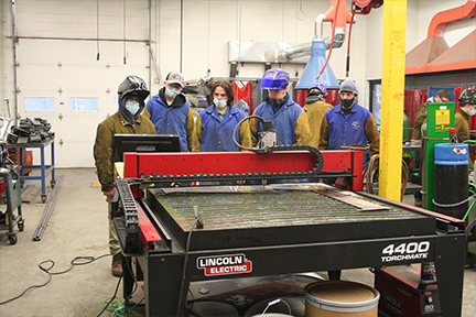Class watching plasma cutter in action
